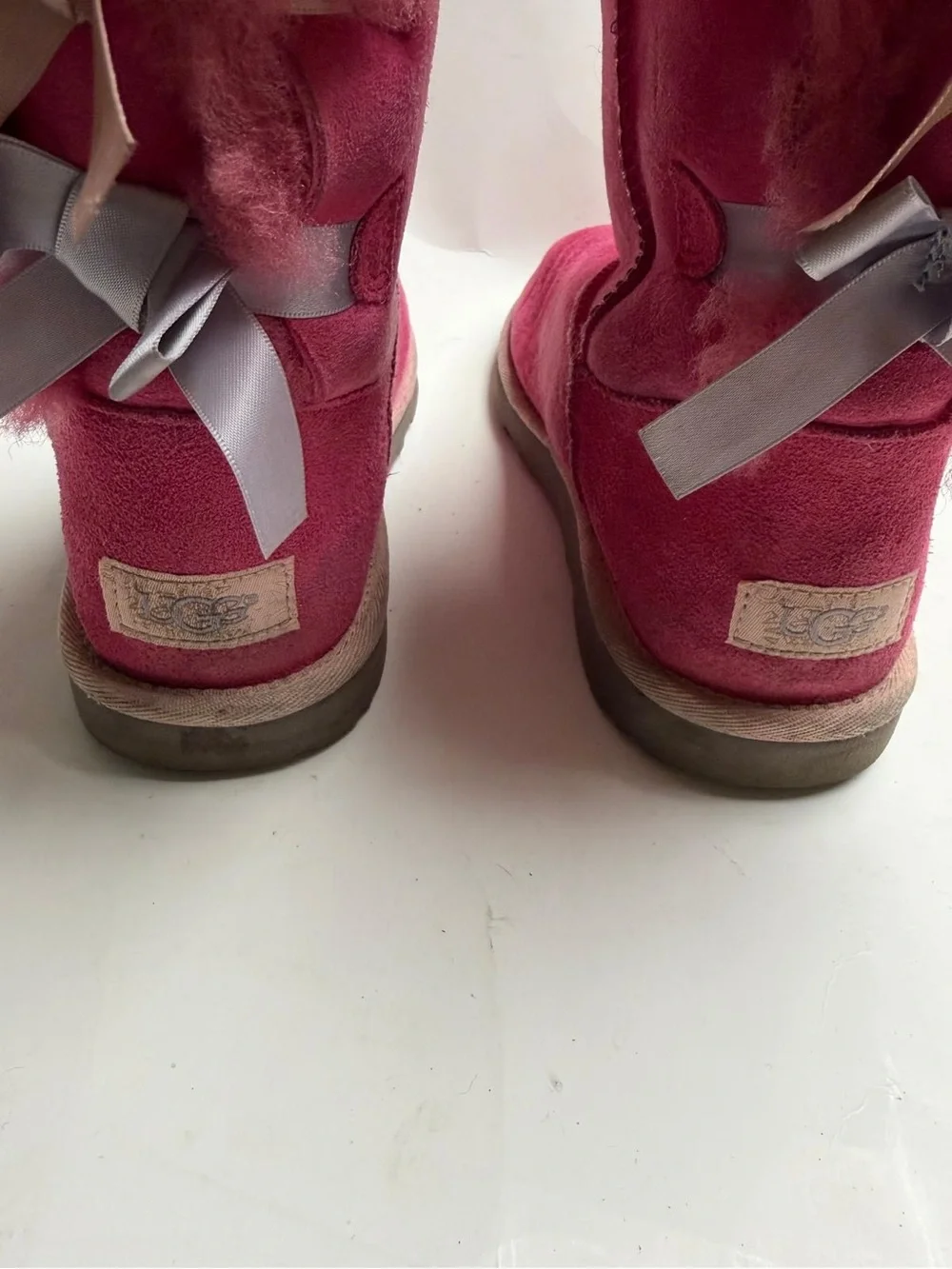 UGG Kids Fuchsia Suede Shearling Boots. They are a bit dirty on the back.